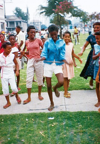 A funeral procession turns into a joyous occasion.<br /> Photo: William Claxton