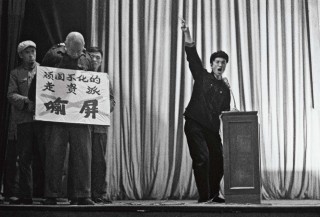 Senior leader Yu Ping is denounced by a fanatical worker at a session in Liaoning to humiliate officials overthrown by factions loyal to Mao. Yu Ping, one time secretary of Liaoning Provincial Committee of the Chinese Communist Party, was ousted at the beginning of the Cultural Revolution, and then denounced. The sign hanging round his neck reads "Yu Ping, diehard capitalist-roader". He survived the Cultural Revolution, and may have had some satisfaction from being appointed a member of the jury in the trial of the "Gang of Four". He died in 1995. Photo (c) Jiang Shaowu, 1966