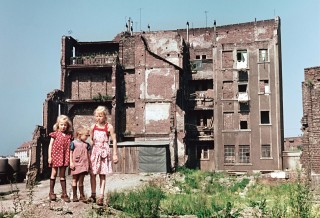 Children on a bomb site in Cologne. There are still people living in the less damaged parts of the house.<br /> Photo (c) Josef Heinrich Darchinger, 1956