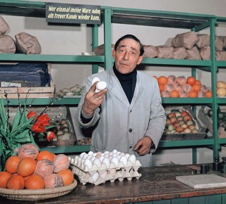 A home-made set of shelves in the garage under the house - and there's your shop. The eggs are always fresh from the country. They cost 20 pfennigs, scarcely any less than forty years later. Bonn 1955.<br /> Photo (c) Josef Darchinger