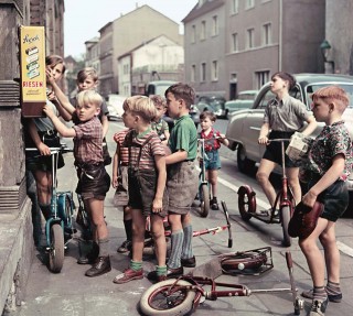 For a Groschen (10 pfennigs) you can buy a bit of heaven: a roll of five caramel toffees. Wonderfully sticky, it's hard not to chew them and unfortunately they can pull out fillings and loose teeth. Bonn 1955<br /> Photo (c) Josef Darchinger