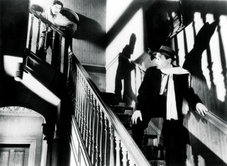 Film Noir <strong>Still from 'The Stranger on the Third Floor' (1940)</strong><br /> Reporter Mike Ward (John McGuire) sees The Stranger (Peter Lorre) running away from a murder scene. As a result Mike is put in jail for murder and his girlfriend has to clear him. This is often cited as the first American film noir because of the coice-over, the shadowy camerawork, the wrong man being accused and the highly expressionistic nightmare sequence.