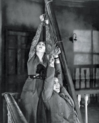 Still from 'Number Seventeen' (1932). Rose (Anne Grey) and Allardyce (John Stuart) are tied together.