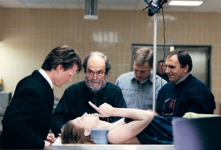 <em>Eyes Wide Shut</em>: Tom Cruise, Kubrick, and Julienne Davis (as the corpse) with director of photography Larry Smith (right). (c) The Stanley Kubrick Estate