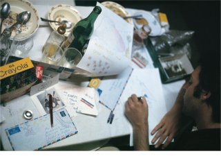<font size="1">Paul writing on a cluttered table (Scotland, 1970).</font>