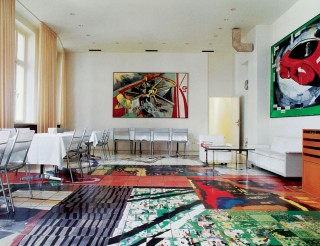 TASCHEN publishing house, casino, with paintings by Martin Kippenberger <em>Vorsicht Durchbruch</em> (centre), 1984, and <em>The capitalistic futuristic painter in his car</em>, 1985, and a floor mosaic by Albert Oehlen. Foto: Taschen, Eric Laignel, 2001