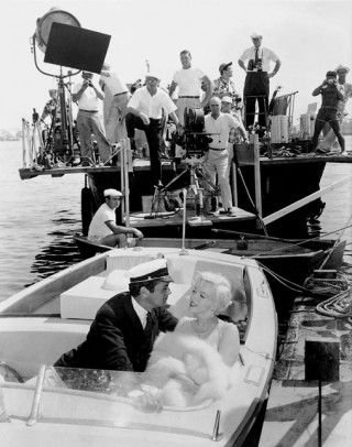 Billy Wilder's Some Like It Hot Tony Curtis and Marilyn Monroe having a not-so-private moment as Wilder and crew watch their every move (MPTV.net)